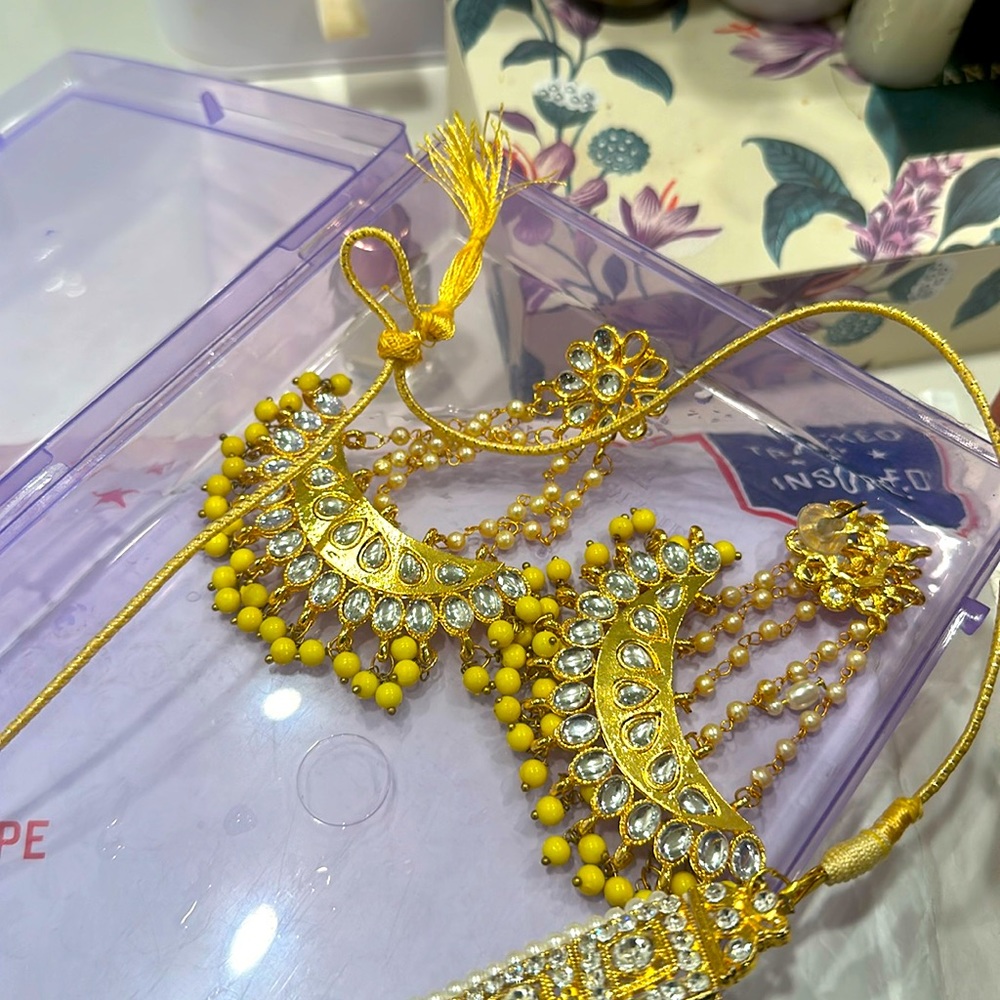 Gold and yellow earring with beads